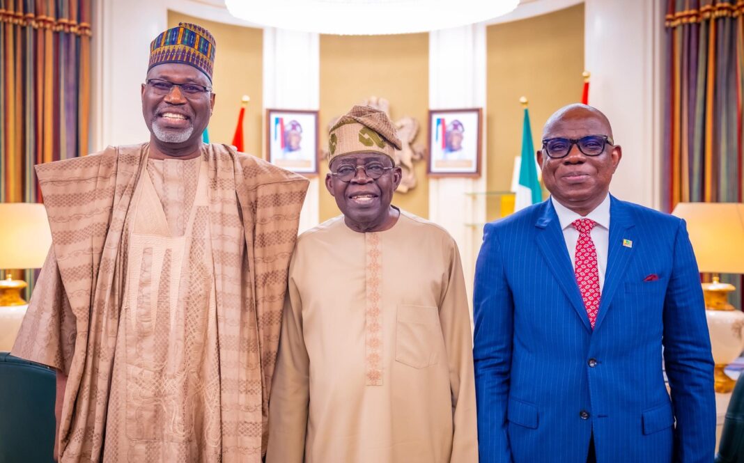 NNPCL Chairman, Engr. Musa Kida (Left), NNPCL GCEO Mr. Ojulari (Right) with President Tinubu at the Inauguration of the NNPCL Board